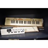 Two electronic musical instruments including a Casiotone MT-35 and a smaller Casio VL-Tone.