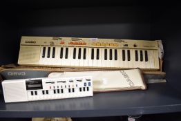 Two electronic musical instruments including a Casiotone MT-35 and a smaller Casio VL-Tone.