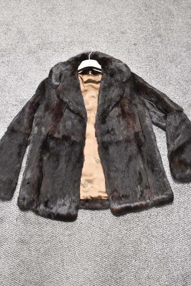 A vintage Coney fur coat, medium size.