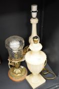 An alabaster table lamp, a cream onyx classical form table lamp, and another, the tallest