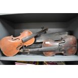 Two antique violins and cases with one bow all as found