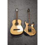 A three quarter acoustic guitar and similar electric guitar.