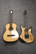 A three quarter acoustic guitar and similar electric guitar.