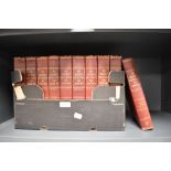 Ten red leather bound volumes of The Children's Encyclopedia by Arthur Mee