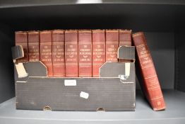 Ten red leather bound volumes of The Children's Encyclopedia by Arthur Mee