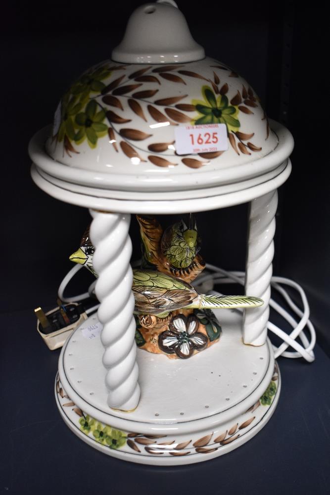 A mid century Derek Fowler lamp base, in the form of a garden pagoda with birds to centre.