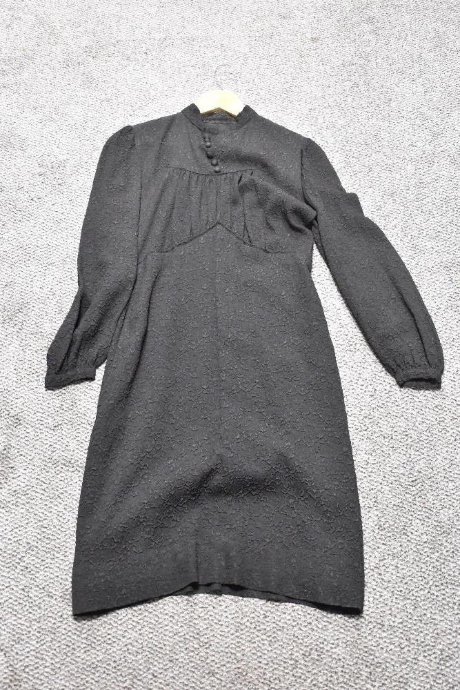 A 1930s/ 1940s textured day dress in black, having wide sleeves gathering into a fitted cuff,