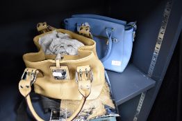 Two handbags, one of blue PVC by David Jones and the other beige leather by Tignanello, both