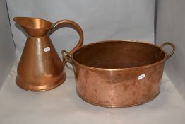A 19th Century planished copper measure and twin handled preserve pan