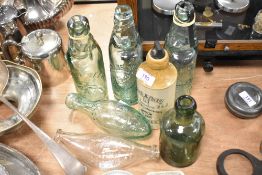A selection of vintage bottles, to include; earthenware ginger beer bottle marked for Dumfries,