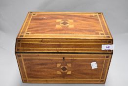 An Edwardian mahogany inlaid work box, with compartmented interior, measuring 17cm x 29cm x 22cm