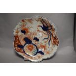 A Japanese Imari shaped dish, with scallop shaped edge, and having a diameter of 32cm