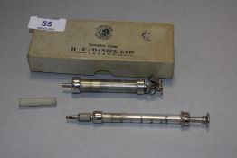 Two vintage glass insulin syringes