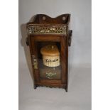 A late 19th Century oak cased gentleman's pipe cabinet, the galleried upper level above a glazed