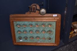 An Edwardian oak cased servant's 18 bell indicator box, measuring 50cm x 56cm