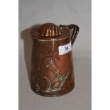 A 19th Century Joseph Sankey & Sons copper lidded jug, of Art Nouveau design, and measuring 13cm