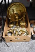A selection of brass ware, including Indian Lassi cups, charger with traditional Indian scenes,