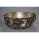 A large Victorian style silver plated punch bowl, the body decorated in relief with fruiting