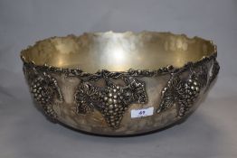 A large Victorian style silver plated punch bowl, the body decorated in relief with fruiting