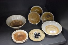 A small collection of Chinese Teksing and Swatow glazed pottery bowls and dishes