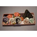 A small collection of vintage pin badges, including a George Best Manchester United badge, a Brookie