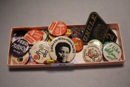 A small collection of vintage pin badges, including a George Best Manchester United badge, a Brookie