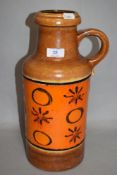 A mid-20th Century West German vase, by Scheurich, with a loop handle and a decorative orange