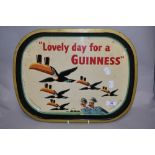 A mid-20th Century Guinness toucan advertising tray, measuring 40cm long and 30cm wide