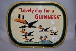 A mid-20th Century Guinness toucan advertising tray, measuring 40cm long and 30cm wide