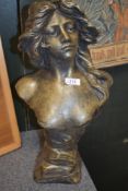 A cast composite bust, having bronze effect finish.