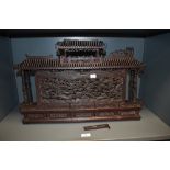 A 19th Century Chinese carved wood miniature temple shrine, intricately carved all over, and
