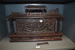 A 19th Century Chinese carved wood miniature temple shrine, intricately carved all over, and