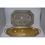 A Victorian gilt metal twin handled serving tray, of elongated form, and an Eastern brass