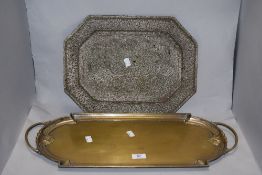 A Victorian gilt metal twin handled serving tray, of elongated form, and an Eastern brass