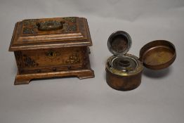 A 20th century oak lidded jewellery box with metal mounts and an inkwell