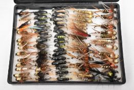 A pocket box containing approximately 75 fishing flies. Prince nymph, Corixia, Hare lug and Black
