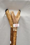 Two Antler topped thumb sticks measuring approximately 124cm