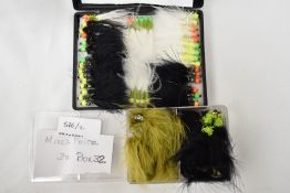 Two pocket boxes of fishing flies containing approximately 60 flies. Black Fritz specials and