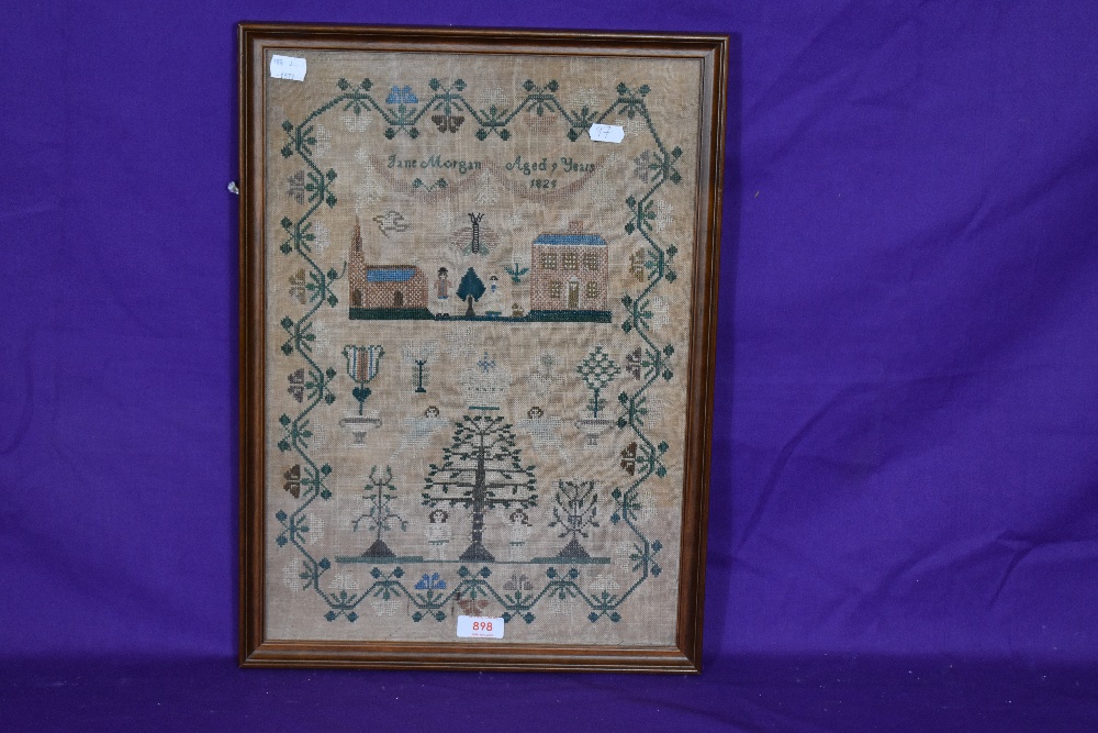 A 19th Century needlework sampler, 'Jane Morgan, Aged 9 years, 1828', neatly embroidered with - Image 2 of 3
