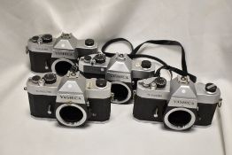 Four Yashica TL-Electro camera bodies Nos 40702803, 40401276, 31204659 & 60104330 one in original