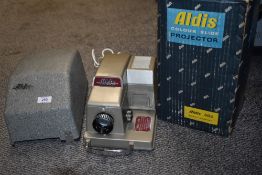 A boxed Aldis 303 slide projector