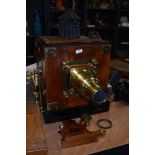 A Newton & Co, Fleet St, London mahogany and brass magic lantern/ projector with two boxes of