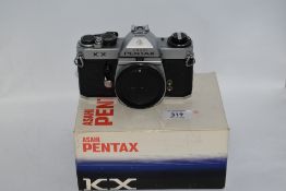An Asahi Pentax KX camera body in original box