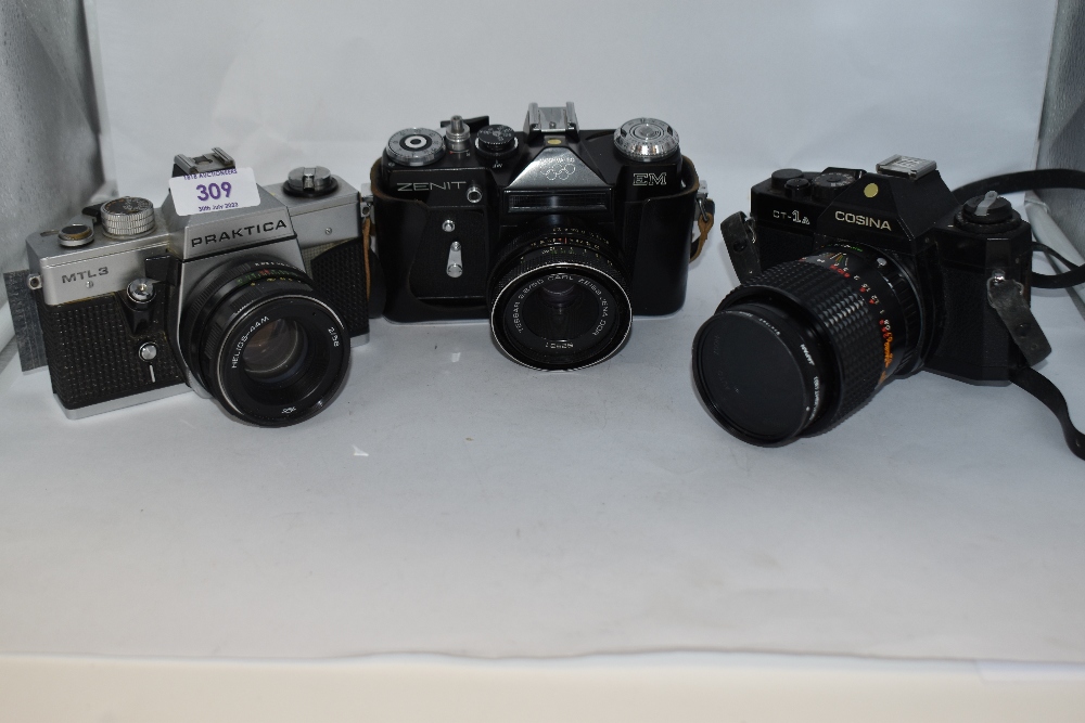 Three cameras and lenses. A Zenit EM Moshva 80 Olympic with Carl Zeiss Jana Tessar 2,8/50 lens, A