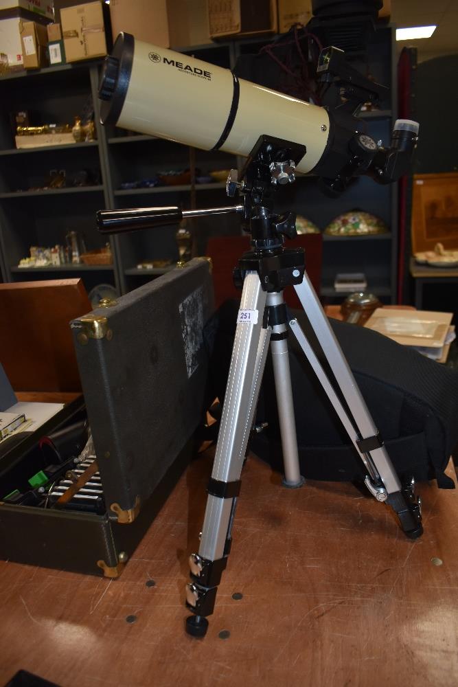 A Meade Adventure Scope 80 telescope on tripod having soft carry bag