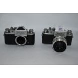 Two Zenit C camera bodies Nos 60010810 & 60287168 one with Helios-44 2/58 lens