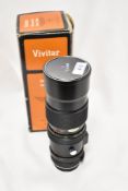 A Vivitar Auto Zoom 1:4,5 75-260mm lens No37513875. Boxed