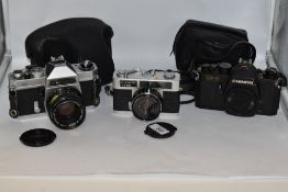 Three Chinon cameras. A Chinon CE-3 camera body No162074 and a Chinon35EE camera No105946 with a