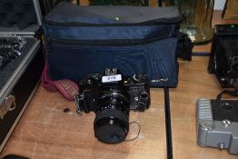 A Carl Zeiss Jena Jenaflex AC-1 camera with Prakticar Auto Zoom 1:3,5-4,8 f=35-70mm lens and a