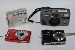 Three digital and one 35mm cameras. A Polaroid IX828, a Fujifilm Finepix F401, a Fujifilm Finepix AV